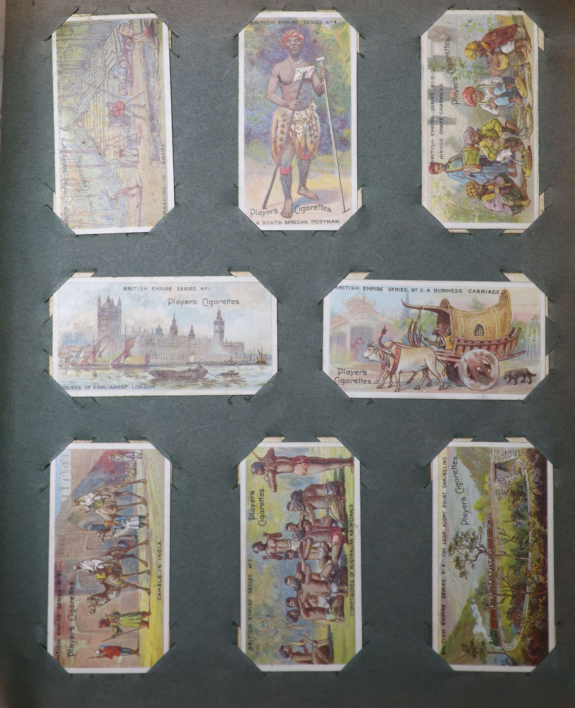 A collection of assorted cigarette cards and tea cards